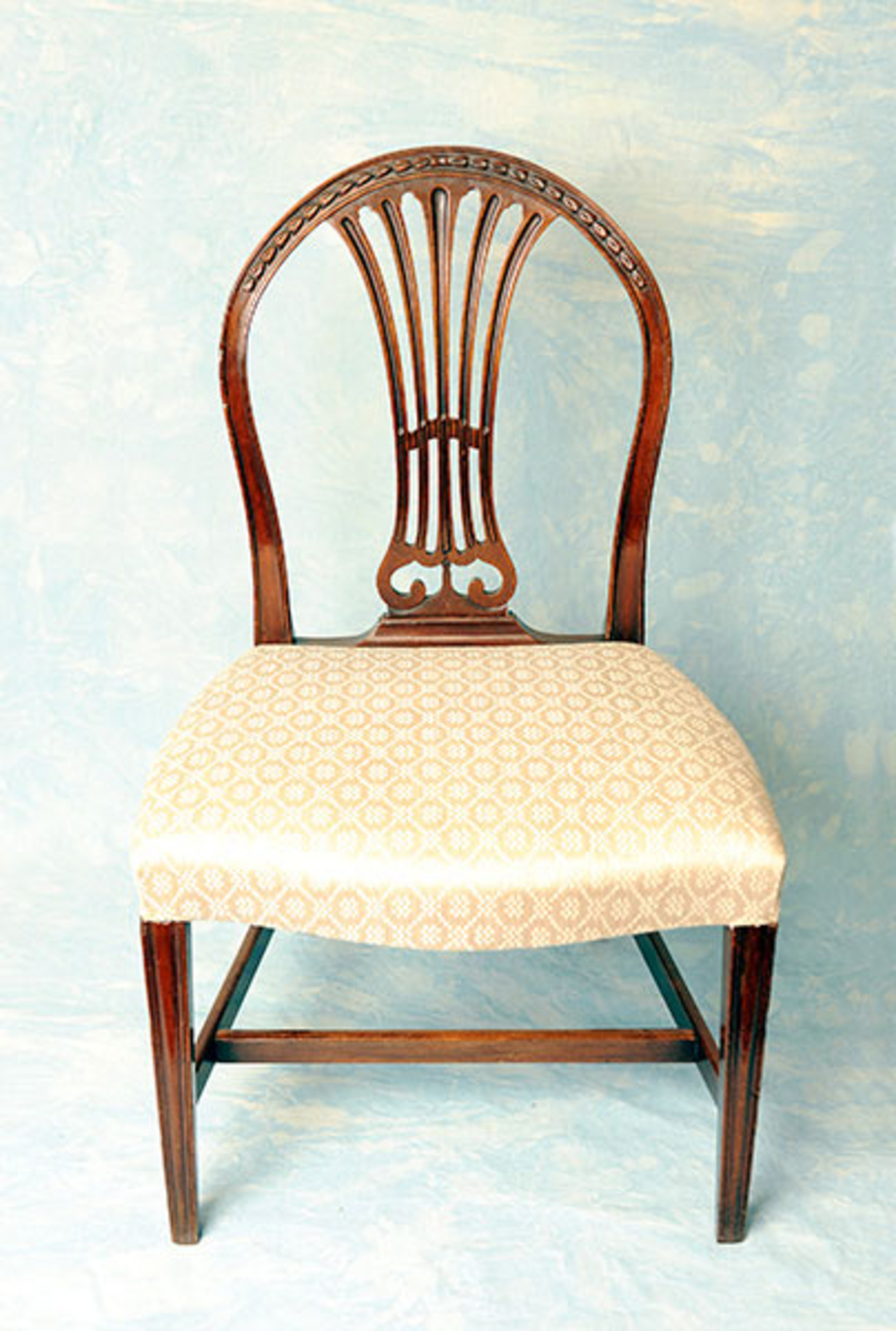 A very attractive set of late 18th century mahogany dining chairs in the Hepplewhite taste